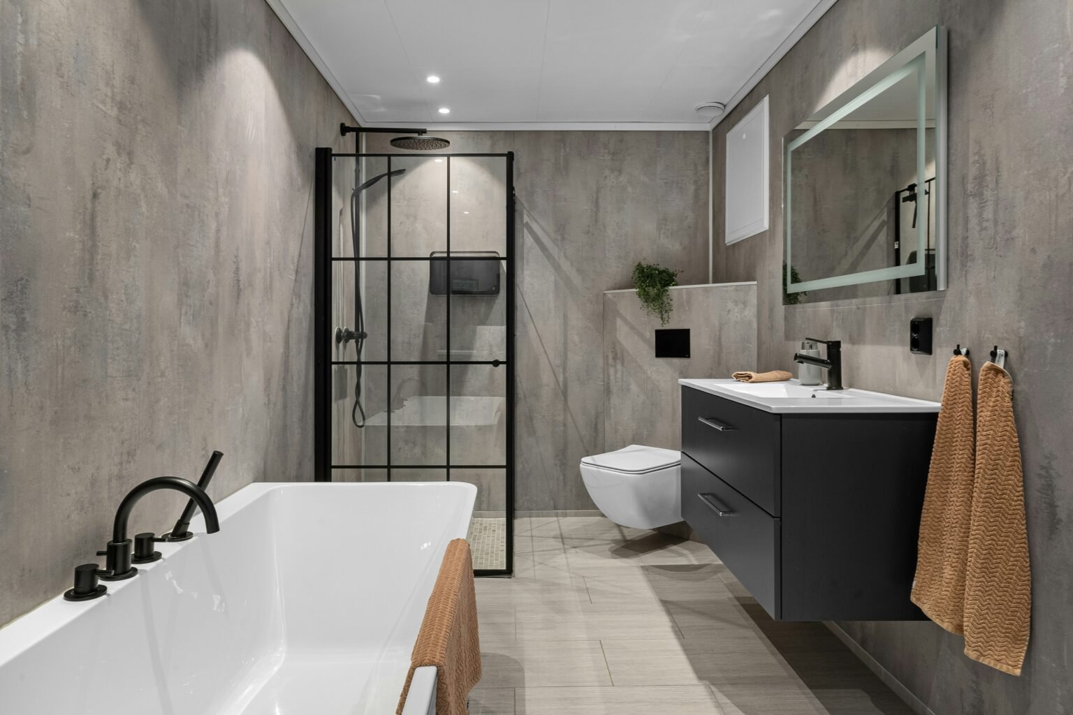 Dark-colored spa-inspired bathroom. Bathroom remodeling in Brooklyn.